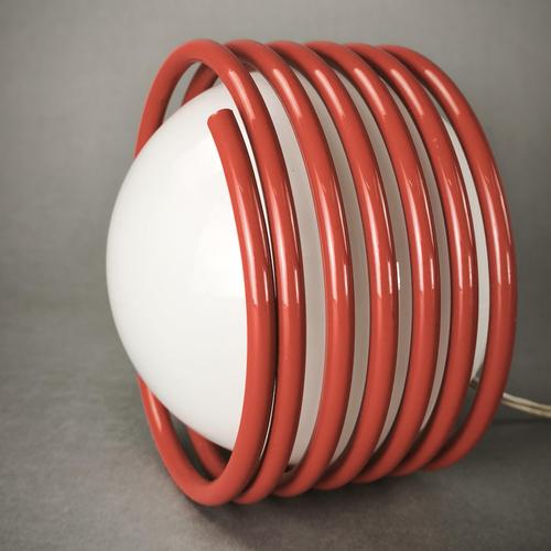 A pair of two spring-operated table lamps, designed in the 1970s. The spring structure is made of red-colored metal and...