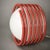 A pair of two spring-operated table lamps, designed in the 1970s. The spring structure is made of red-colored metal and...
