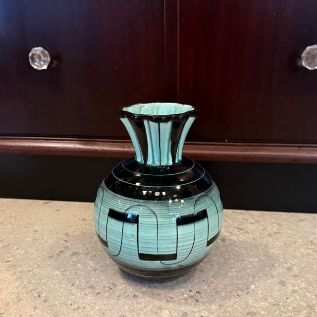 This Art Deco, art pottery vase represents an exquisite example of early Swedish modernism, designed by Ilse Claesson for...