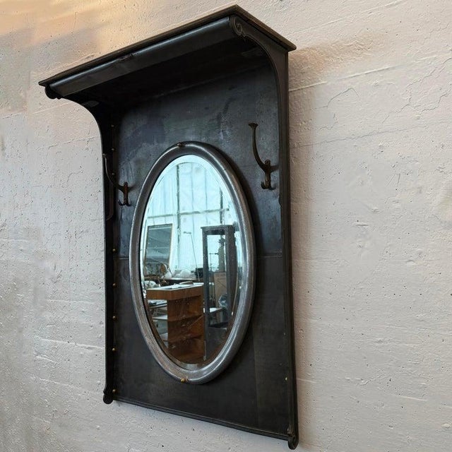 This custom industrial entryway hall tree mirror is created by cityFoundry in Brooklyn, NY. The reclaimed brushed steel,...