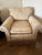 Stunning Ralph Lauren floral fabric covered chair and ottoman. Trimmed in coordinating braiding and heavy fringe.