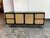 Design Plus Gallery presents the Ida Woven Media Console by Williams Sonoma for West Elm. This media console has a solid...