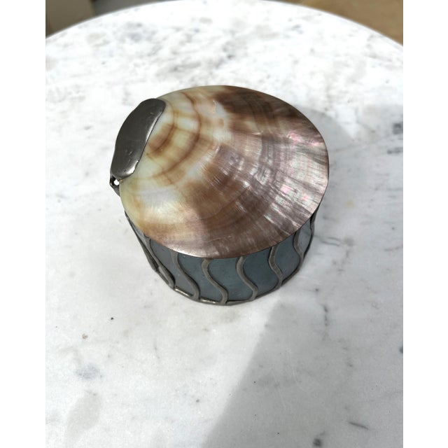 Very unique and gorgeous box, hand crafted and hand soldered, with seeded glass and a polished iridescent shell. Flowing...