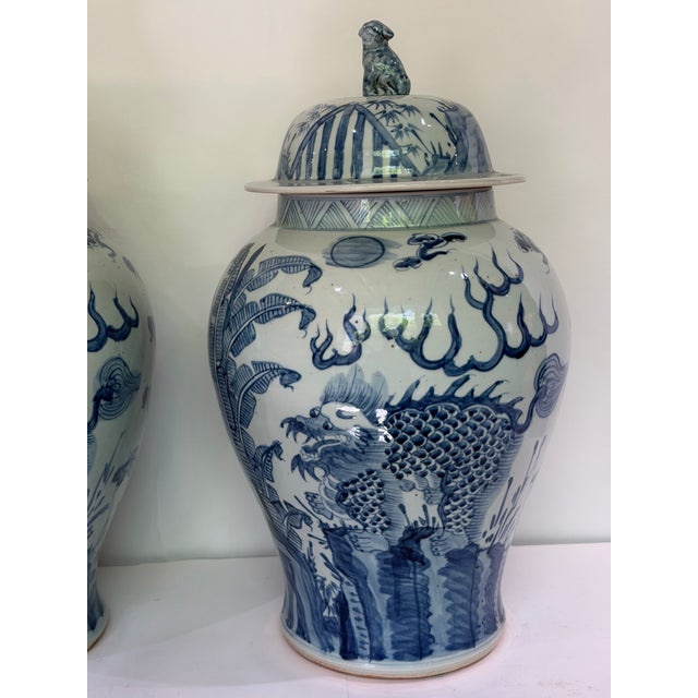 Late 20th Century Pair Monumental Blue & White Chinese Porcelain Covered Dragon Temple Jars With Foo Dog Finials, 23” H For Sale - Image 5 of 12