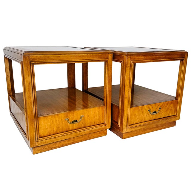 This striking pair of end tables from the Drexel Accolade collection perfectly captures the intersection of Campaign...