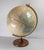 We are selling this decorative Mid-Century table globe. This globe is by Cram’s and is the Imperial world globe model on a...