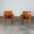 A beautiful pair of cab 413 armchairs designed by mario bellini for cassina, presented in their original cognac saddle...