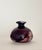 Beautiful handcrafted oxblood glazed ceramic vase. Artist signed.