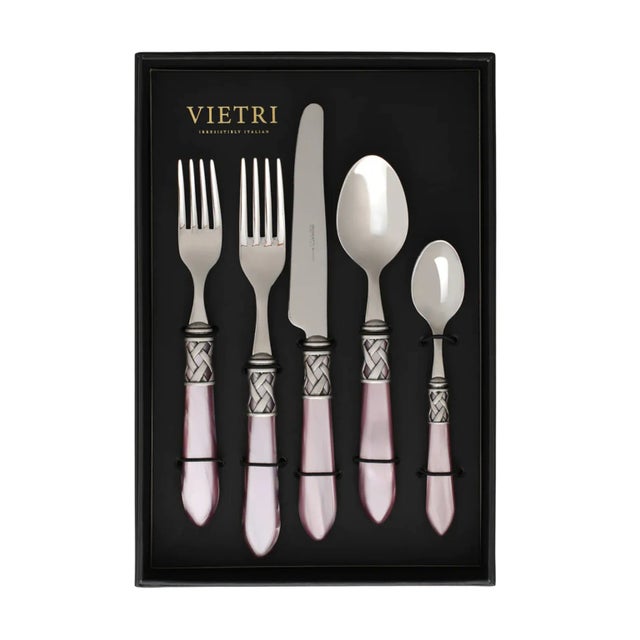 The Aladdin Antique Flatware Five-Piece Place Setting - service for one guest - features elegant pearlized handles with...
