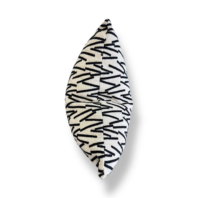 This 20x20 pillow is crafted from ivory linen and features bold black embroidery in a modern zigzag pattern. The contrast...