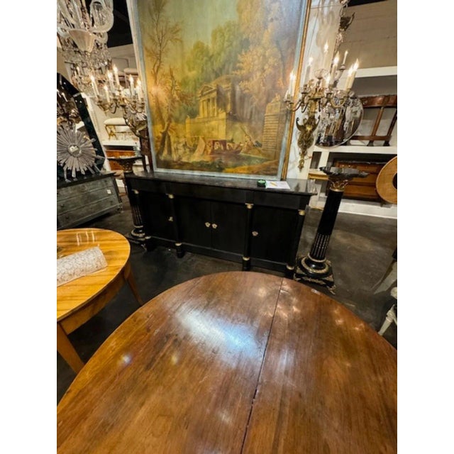 Late French Louis XVI style gilt bronze and black lacquer pedestal. Circa 1890. This pedestal is perfect for a statue or a...