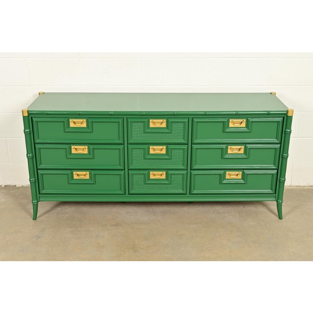 An exceptional mid-century modern Hollywood Regency Campaign triple dresser or credenza By Stanley Furniture USA, Circa...