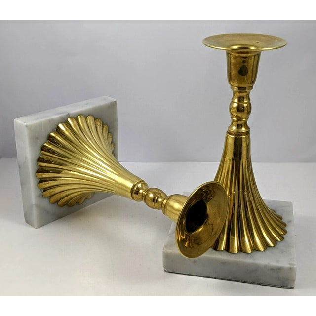 Elevate your décor with this elegant set of two vintage Italian candlestick holders, crafted from solid ribbed brass and...