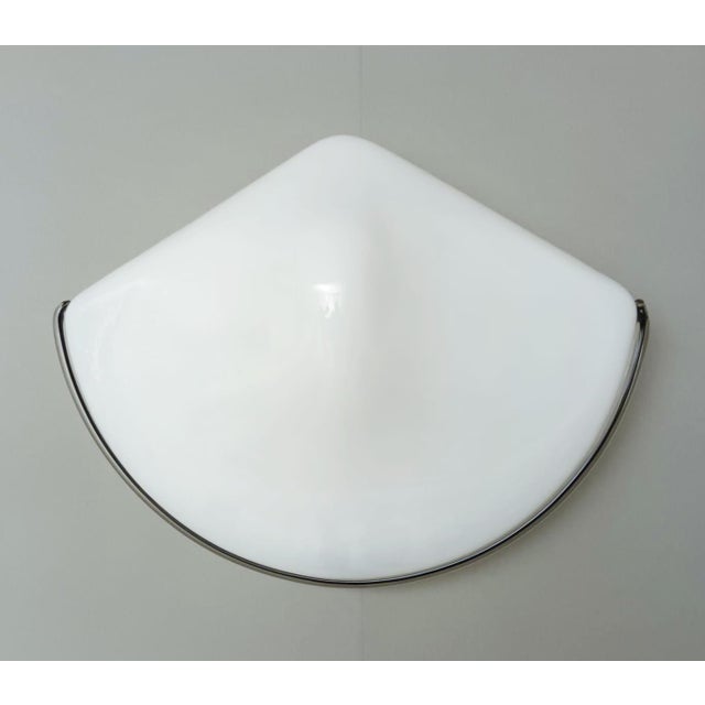 Vintage Italian wall light with triangular Murano glass shade in milky white color with black border / Made in Italy in...