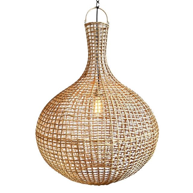 Hand woven raw rattan pendant light. Stylish round jug shape with basket weave design. Each may have slight variations in...