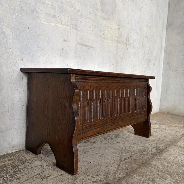 A characterful carved oak blanket box with Arts & Crafts and Gothic Revival influence, dating from the early 20th century....