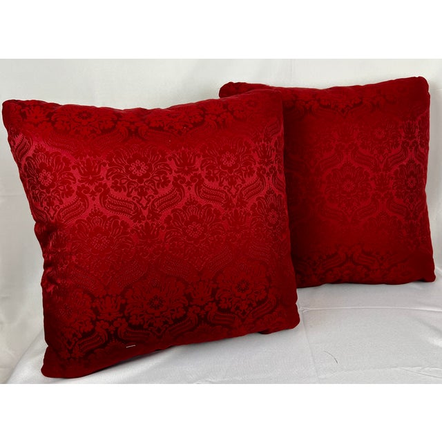 Pair of antique hand stitched exotic floral needlepoint cushions/pillows. The needlepoint is appliqued to the pillow top...