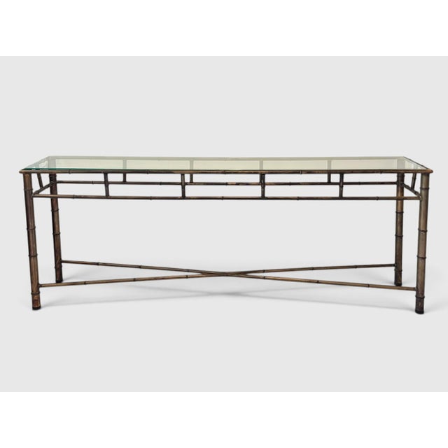 72 inch Hollywood Regency faux bamboo bronze tone metal console sofa table with glass top.
