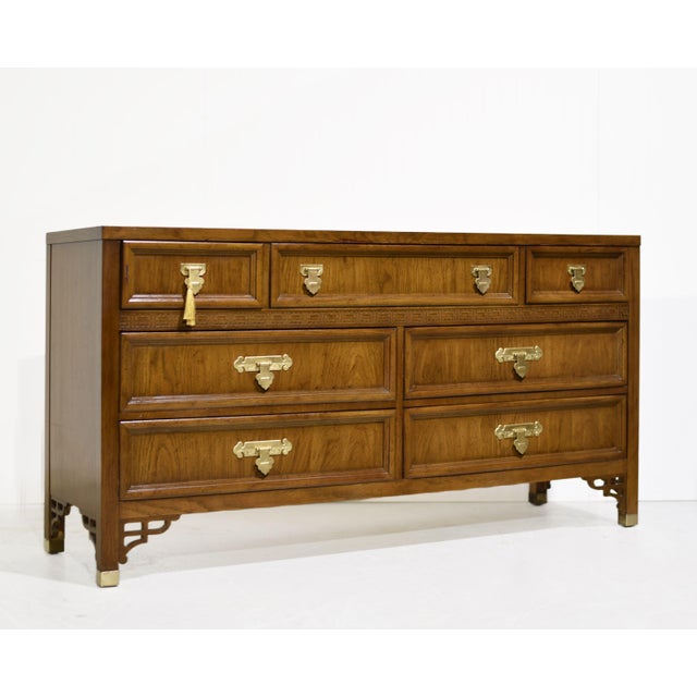Bring timeless character and practical storage to your home with this handsome mid-century Chinoiserie triple dresser by...