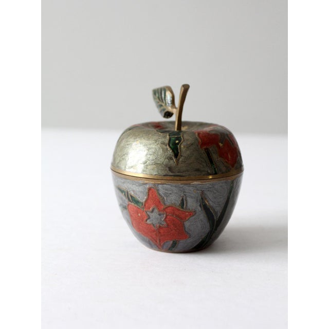This is a vintage cloisonne brass apple box. Store your jewelry and littles in this decorative brass box. A sweeping...