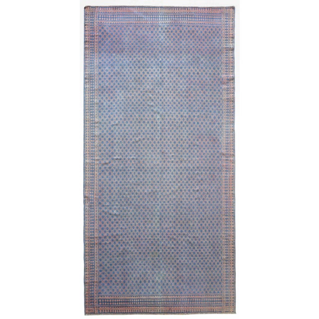 A wonderful mid-20th century reversible Persian Saveh cotton kilim rug with an all-over geometric star pattern woven in...