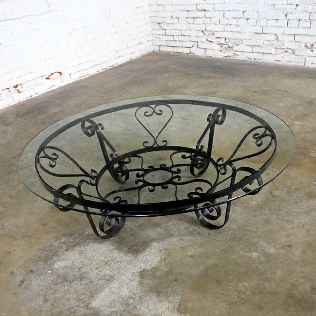 Awesome round rustic Spanish Revival Style hand wrought iron coffee table with 3/8 in. thick 48-inch round glass top....