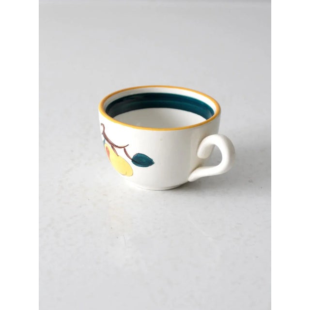This is a vintage Stangl Pottery mug circa 1942 of Kay Hackett design. The "Fruit 1" coffee cup celebrates the bounty of...