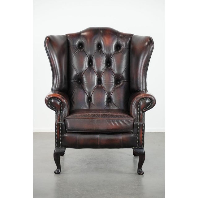 We are offering this beautiful, luxurious, and comfortable brown cowhide Chesterfield wingback chair in a classic English...