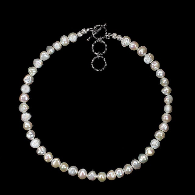A 17‑inch creamy white double‑shine pearl necklace offers a timeless blend of elegance and sophistication. Each lustrous...