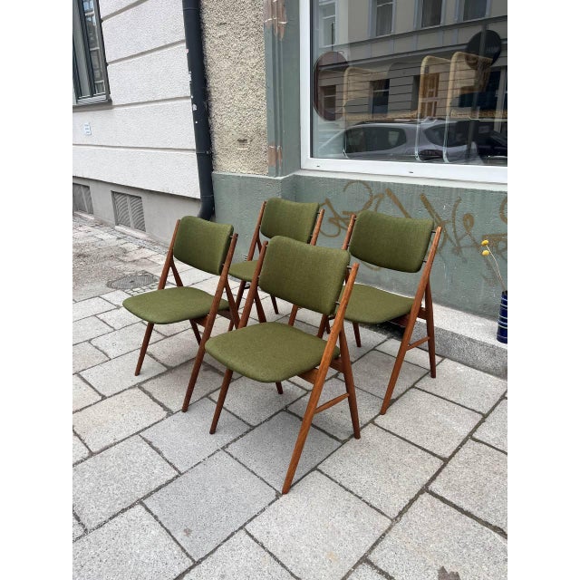 A set of three exceptional chairs, made in Denmark. A delicate and elaborate design made of solid teak, somewhat...