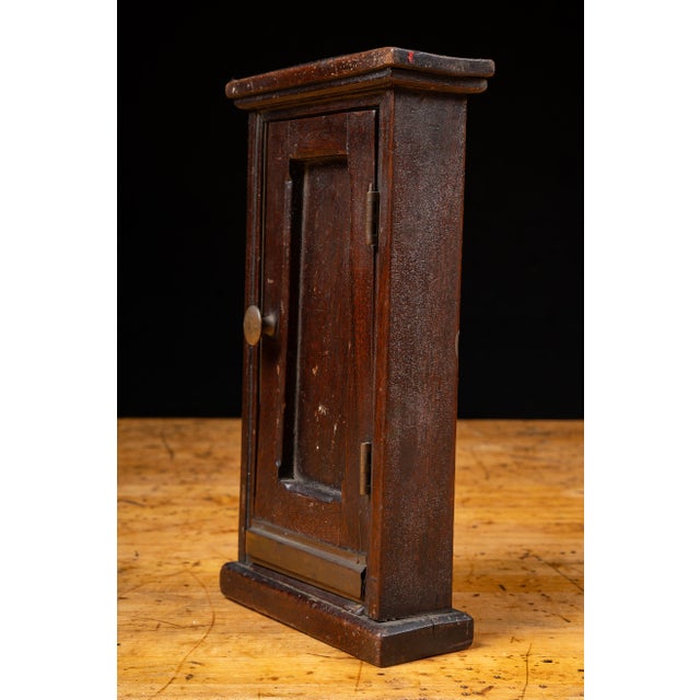 This architectural salesman sample represents a paneled entry door complete with molded casing, brass knob, iron hinges,...