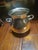 This silver plated pot features an inverted rim and rope-twist side handles, this piece can be used for chilling a small...