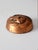 This vintage 1960s cat paperweight features a warm copper-tone finish with a beautifully detailed raised relief depicting...