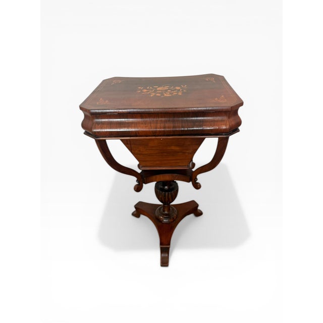 A beautifully crafted Federal-style sewing or work table, featuring rich mahogany veneers and delicate contrasting wood...