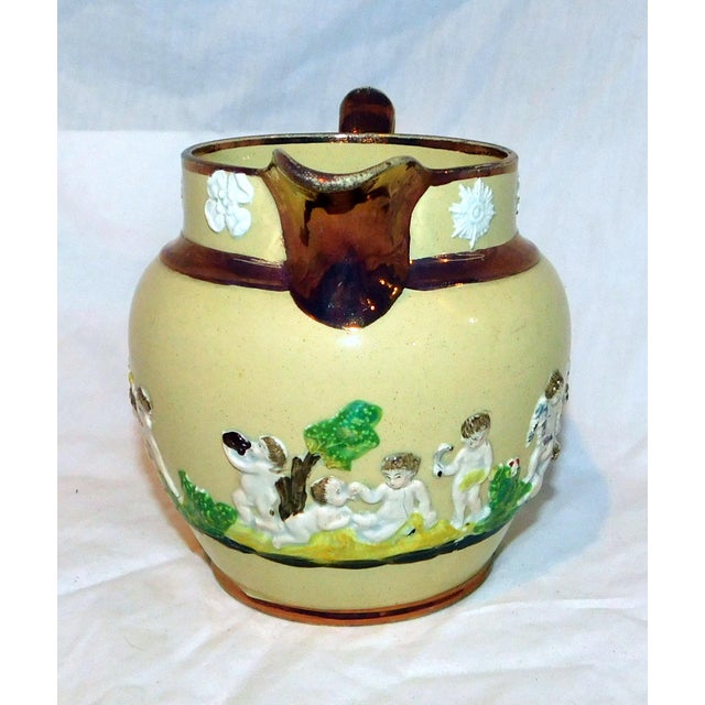 Incredible antique ceramic milk pitcher made by Wood & Caldwell. This English company operated from c. 1790-1818. The...