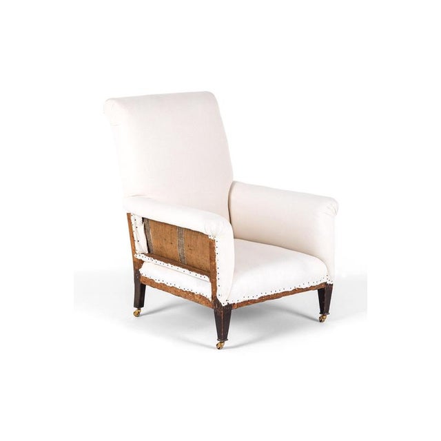 A refined Edwardian deconstructed armchair with a high back and a deep and wide seat of generous proportions in the...