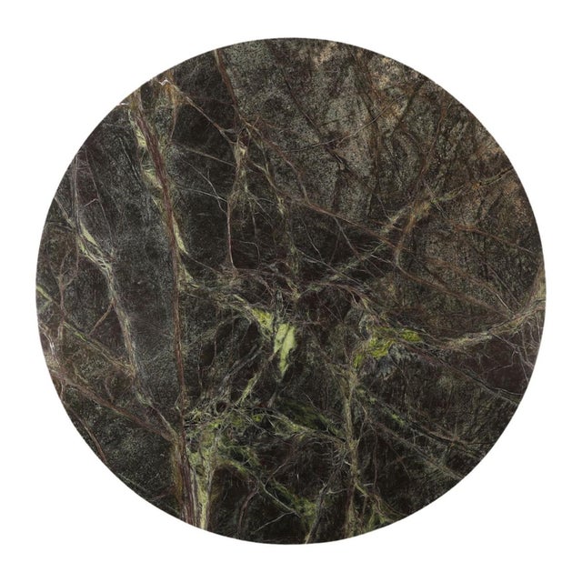 Striking round coffee table with a richly veined Bidasar marble top with a sculptural hammered iron base finished in...