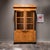Stunning 19th Century Biedermeier style fruitwood vitrine. This exquisite piece showcases a classic Biedermeier style,...