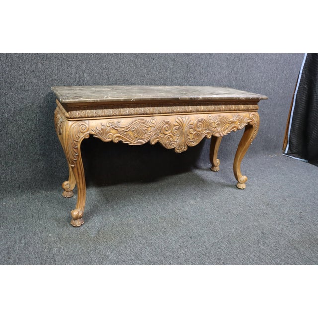 Ethan Allen heavily carved fruitwood console with cabriole legs and thick marble top.
