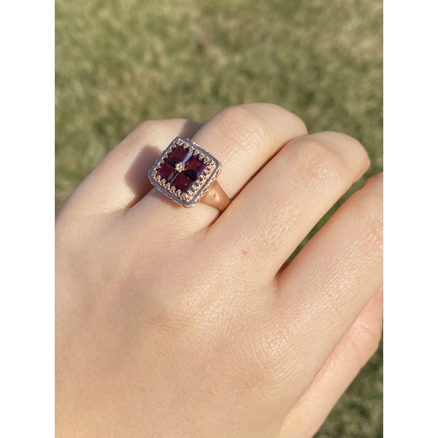 The Clatsop: Ladies Antique Rose Gold and Garnet Cocktail Ring. Crafted in 14 karat rose gold, this antique ring features...