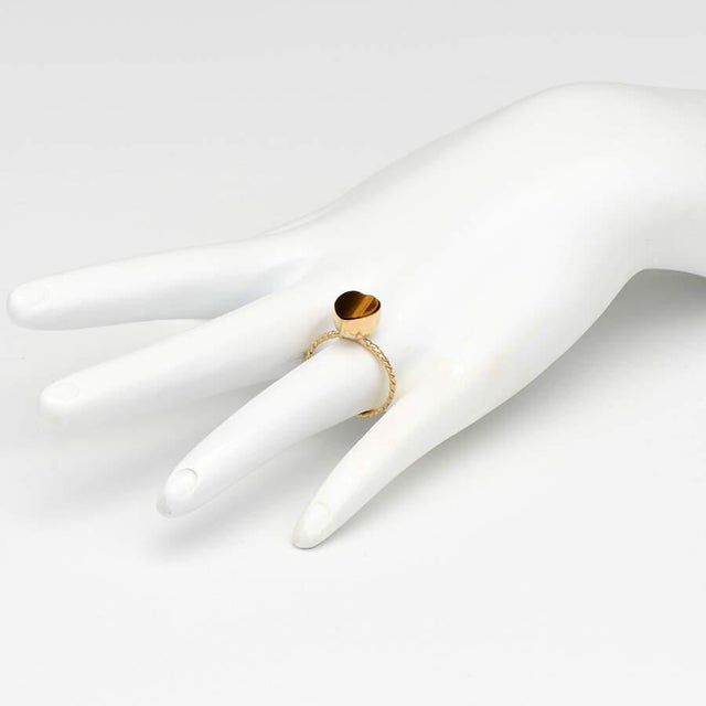 Sparkling yellow gold and earthy tiger's eye create a luxurious heart stack ring that shines in a multitude of dazzling...