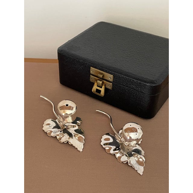 Handsome antique set of silver plated salt and pepper holders. Beautiful leaf shape. Housed in an antique, silk lined box...