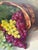 Large luscious colorful original mid century painting of grapes tumbling from a natural wood basket. Robust colors and...