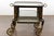 An English black and gold japanned bar cart from the 19th century with Chinoiserie décor depicting figures in landscapes,...
