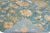 Beautiful modern Oushak hand-knotted wool rug with a blue field. This Oushak rug has orange and ivory accents in a...