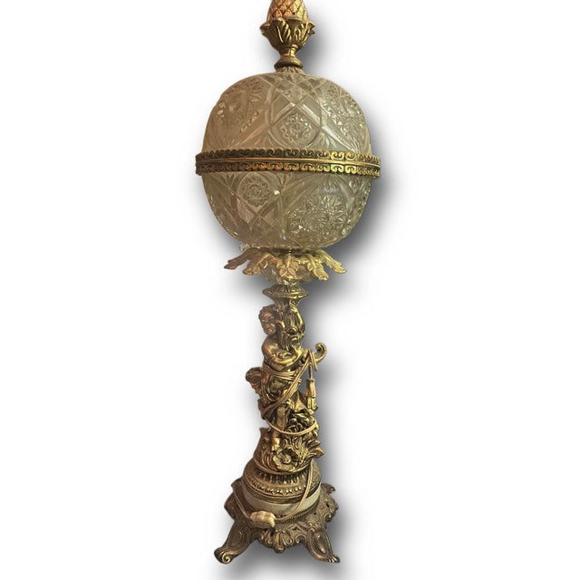Vintage French Style Hollywood Regency Gold Gilt Metal Cherub Crystal Glass Globe Table Lamp. Circa Mid 20th Century.