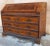 Bureau chest of drawers with shaped flap from the 18th century in walnut and herringbone walnut with maple fillets. Origin...