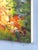 Inclination presents a vibrant landscape where sunlight dances across a rocky outcrop, illuminating the warm hues of...