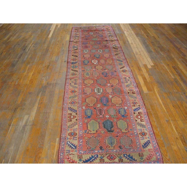 Antique Bakshaish Hallway Runner Wool Coral Rug, Circa Date: 1890s. This exceptional piece originates from the Bakshaish...