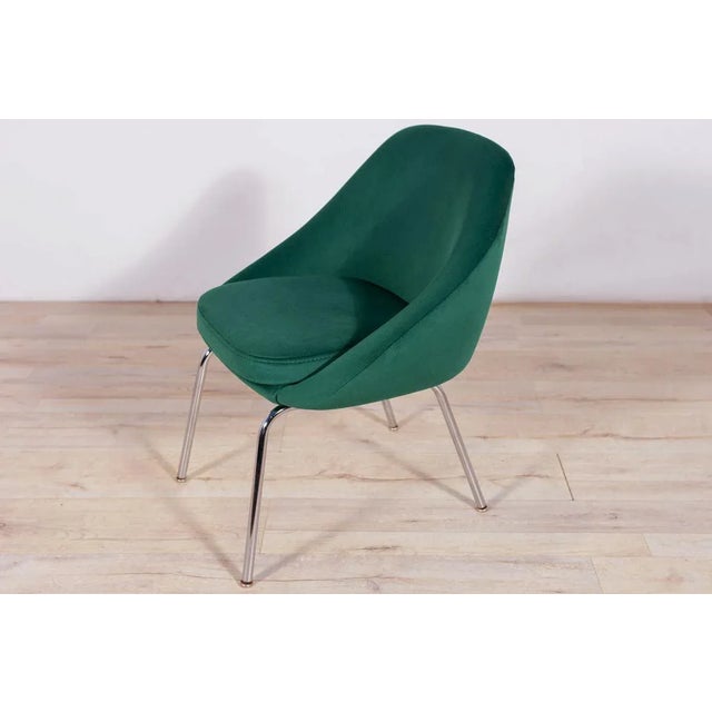 Armchair made in Great Britain in the 1960s. The armchair have undergone upholstery renovation. Upholstery interiors have...